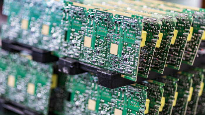 A stack of PCB boards after complete PCB assembly in Schaumburg IL from CircuiTek Solutions PCB Design in Naperville IL