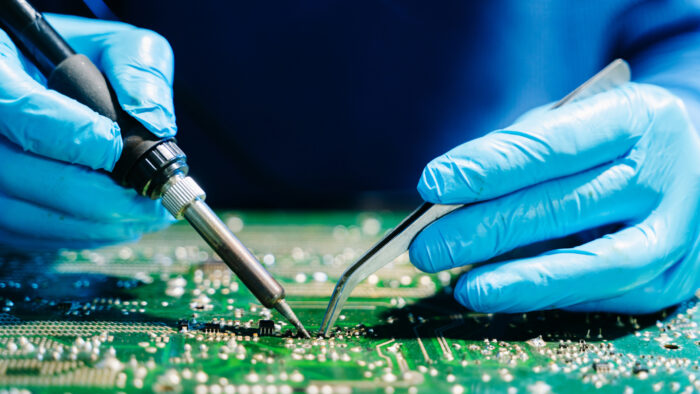 A professional with CircuiTek Solutions working closely to achieve successful PCB assembly near Chicago IL PCB Assembly in Chicago IL