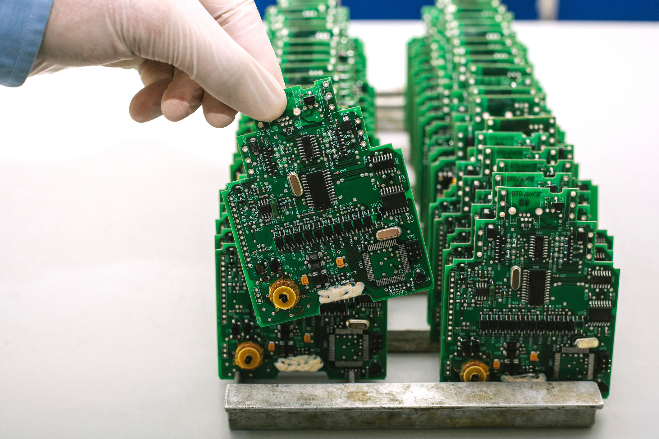 A professional from CircuiTek inspecting circuit boards after PCB manufacturing near Chicago IL