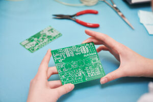 Heavy Copper PCBs: Delivering Reliable Performance in High-Power Applications 1 a tech holds a heavy copper PCB