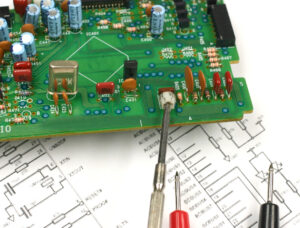 Heavy Copper PCBs: Delivering Reliable Performance in High-Power Applications 2 A tech adjusts a heavy copper PCB