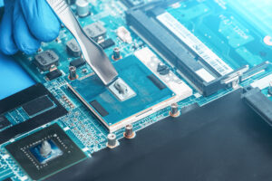 Heat Dissipation Issue? Why Thermal Management Matters from Design to Production 1 .Application of thermal paste on the laptop processor chip for high-quality cooling, illustrating Heat Dissipation Issues and solutions