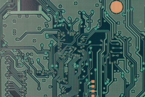 a green circuit board illustrates Improved Vibration Resistance in Your Electronic Device