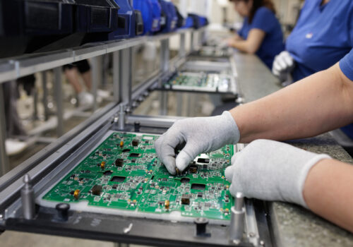 A tech assembles heavy copper PCBs