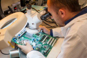 An engineer reviews PCB designs. Circuitek can help explain When Not to Use Heavy Copper PCBs.