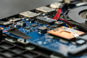 Detailed view of a circuit board inside a laptop illustrates How Advanced PCB Design Can Reduce the Need for Additional Heat Sinks